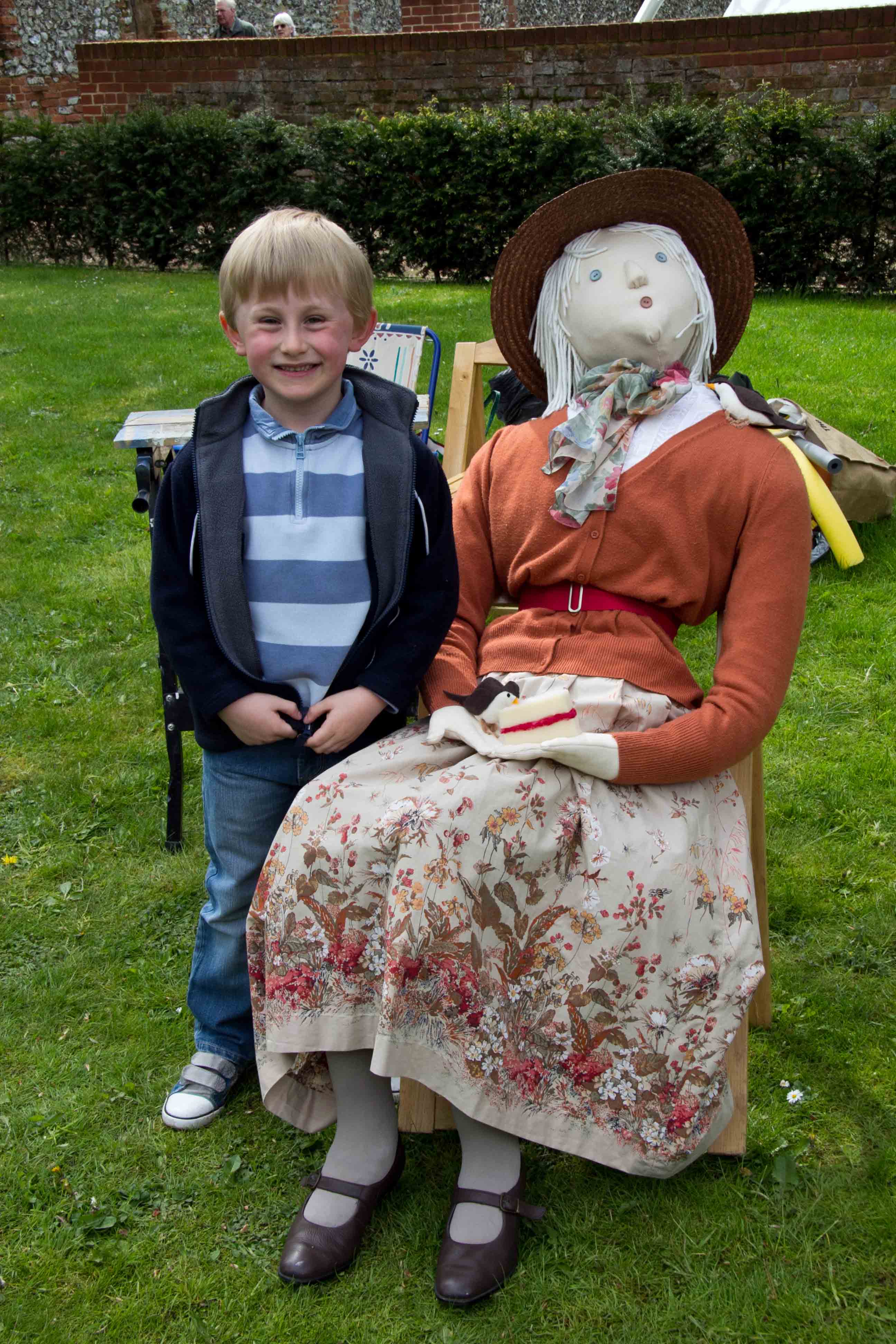 Child with scarecrow