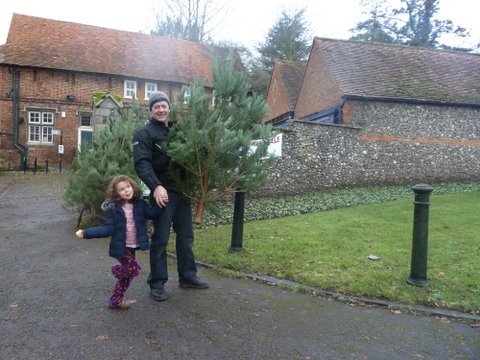 Father and daughter with tree